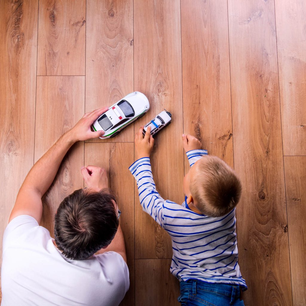 Father with kid playing with toycar | Country Manor Decorating