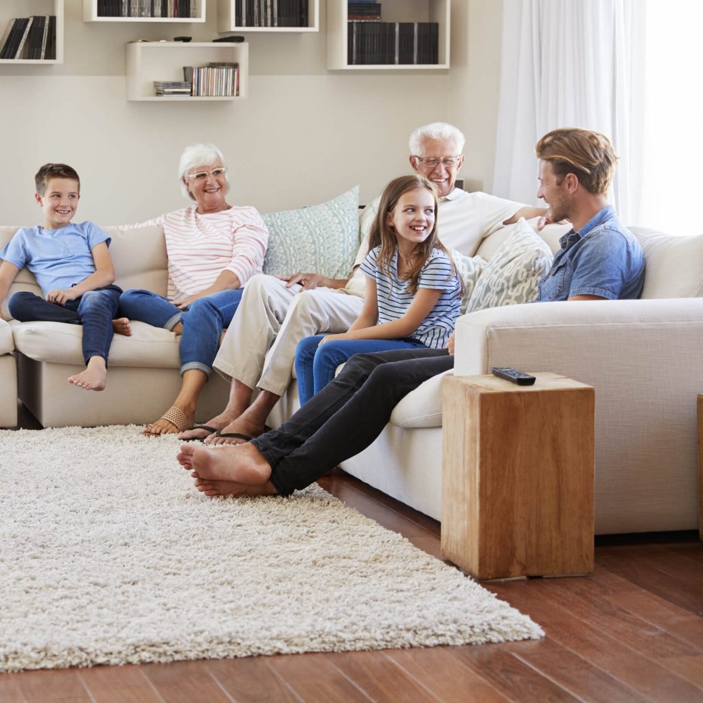 Family gosping in living room | Country Manor Decorating